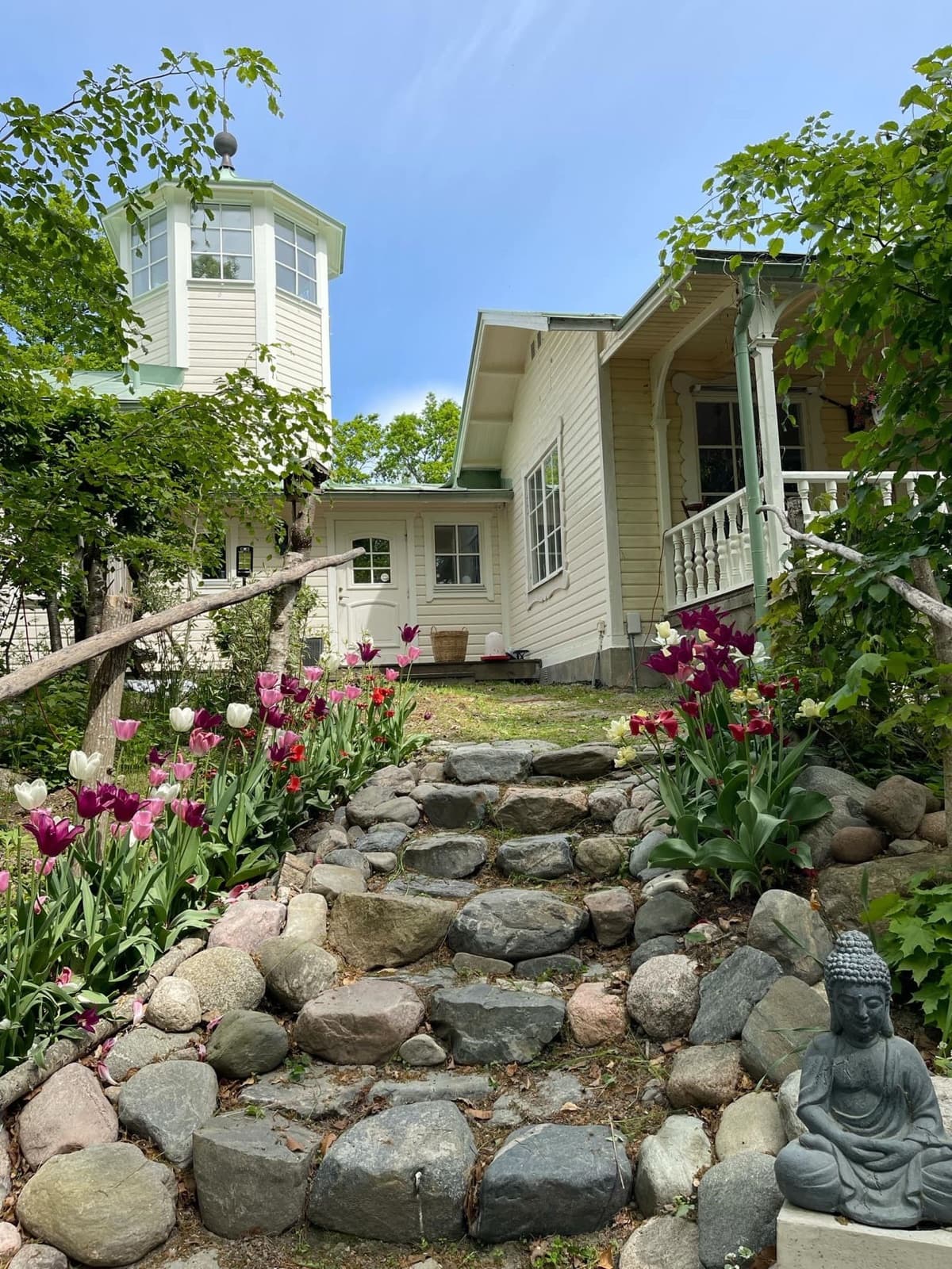 The tower house among spring tulips
