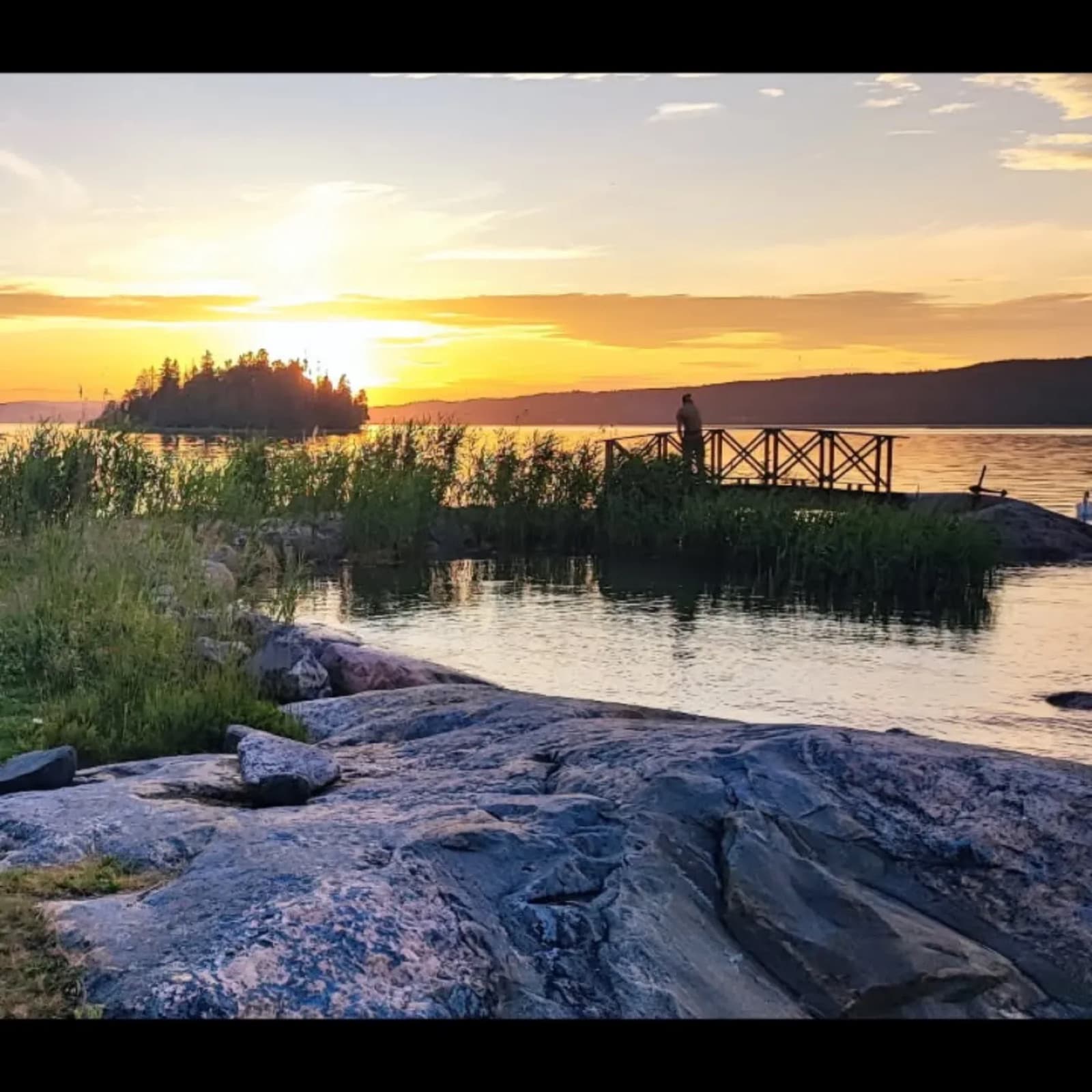 The rocky shoreline at dusk
