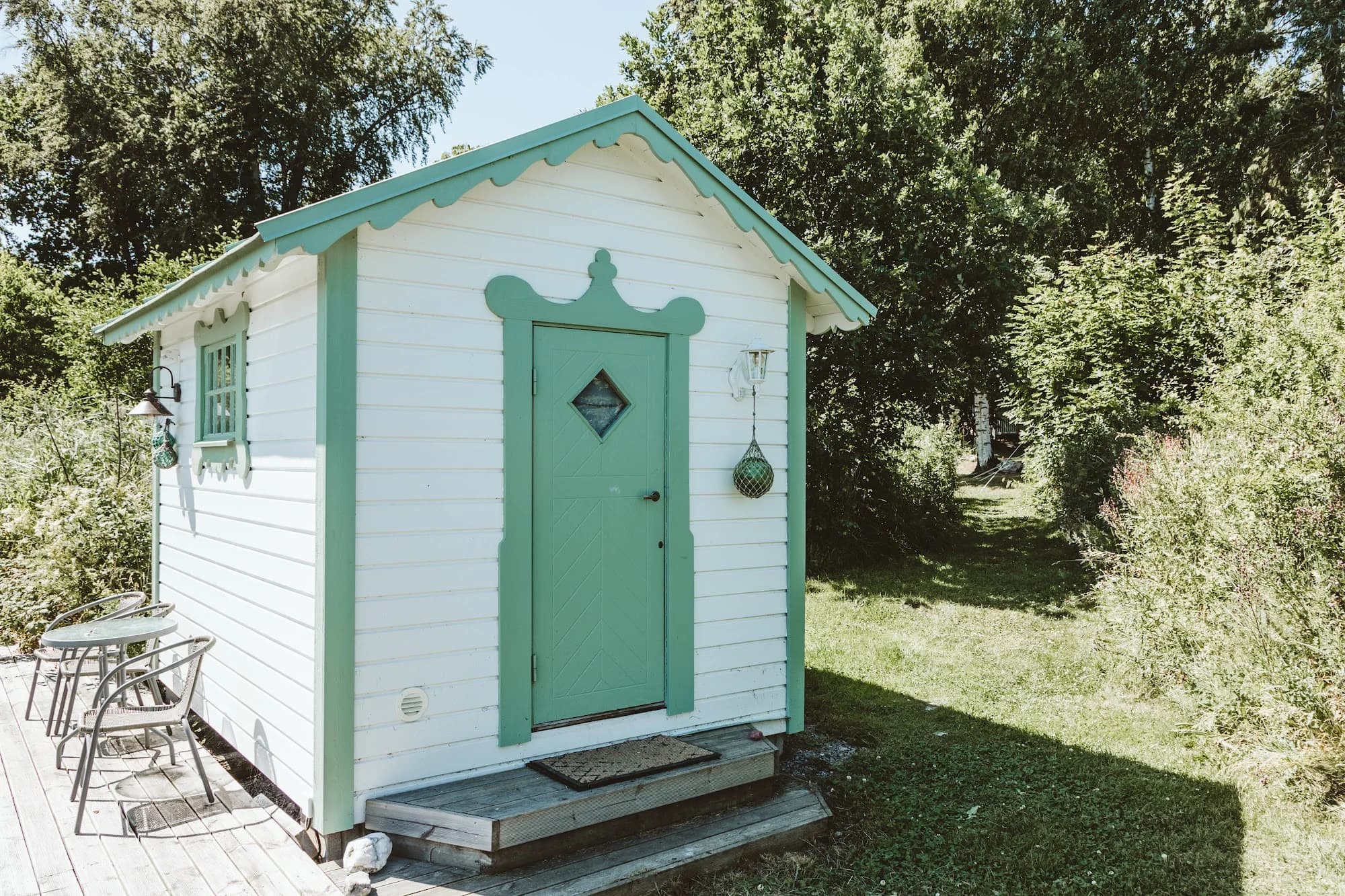 The small white Boat House with its green door