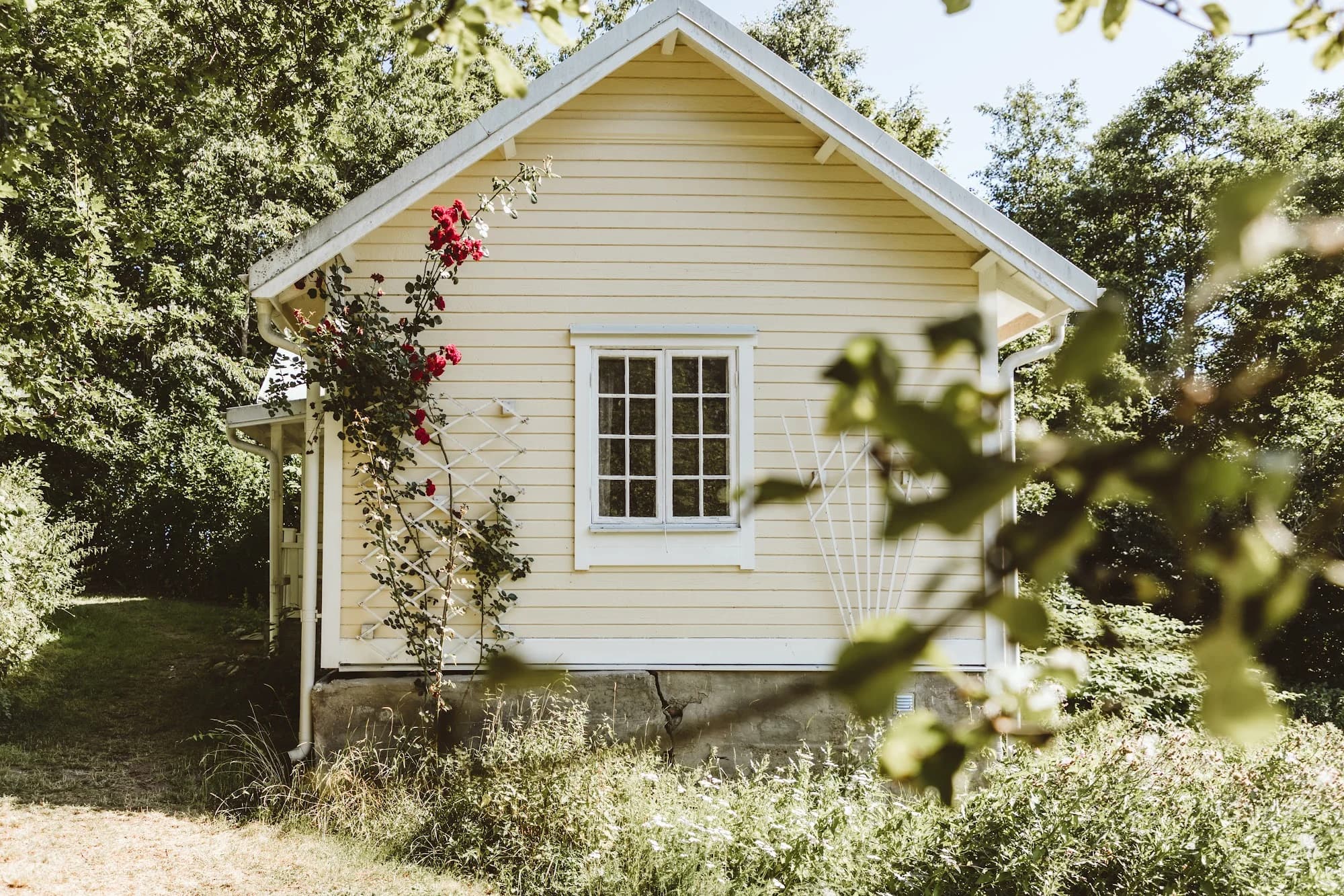 The Gardener’s House with climbing roses