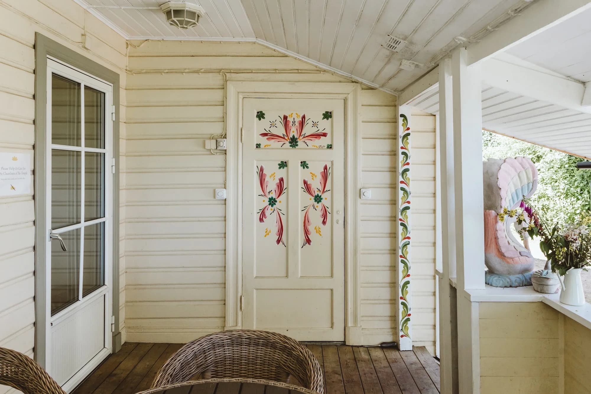 A veranda door decorated with painted flowers