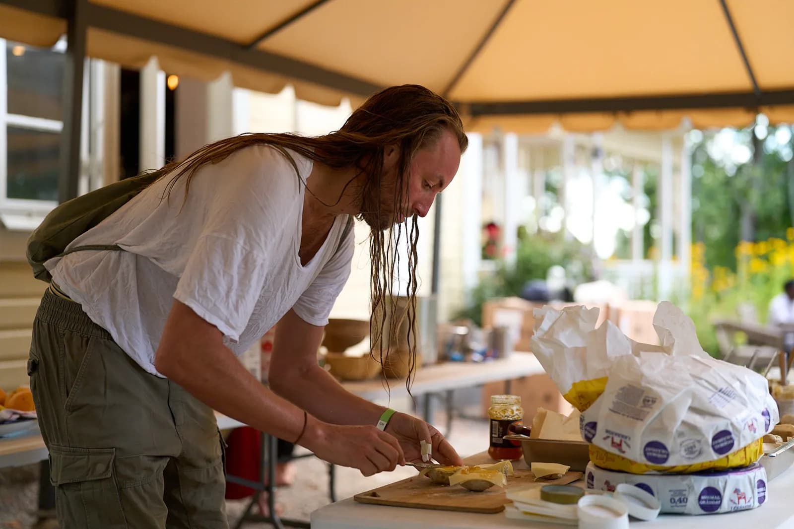 Preparing food at an outdoor kitchen table
