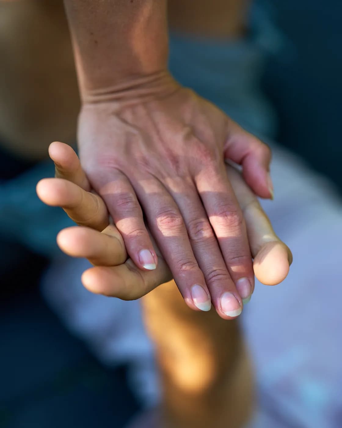 Several hands resting together