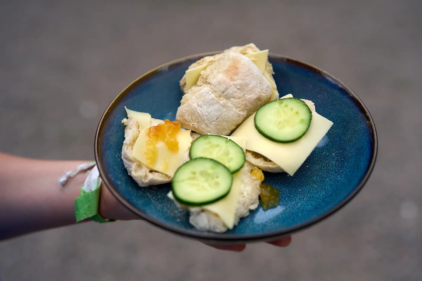 A plate of food held at a gathering